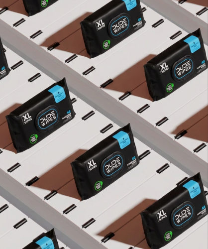 Dude Wipes XL packs on a production line